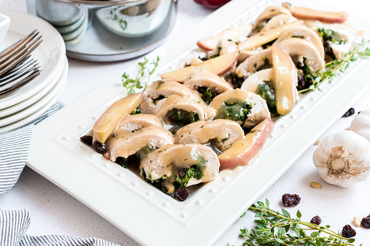platter of stuffed chicken breasts with apple 