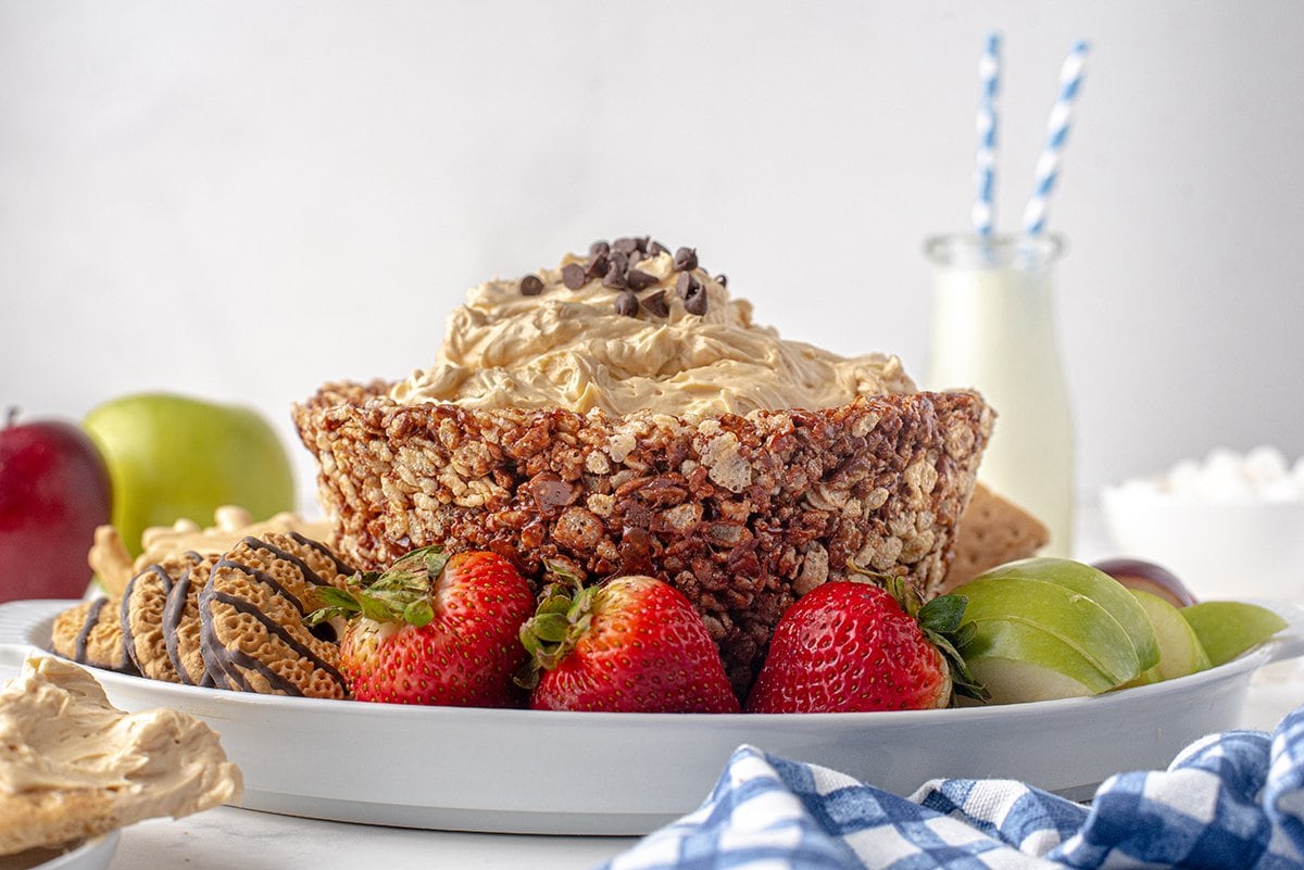 straight on shot of whipped peanut butter dip in chocolate rice krispie treat bowl