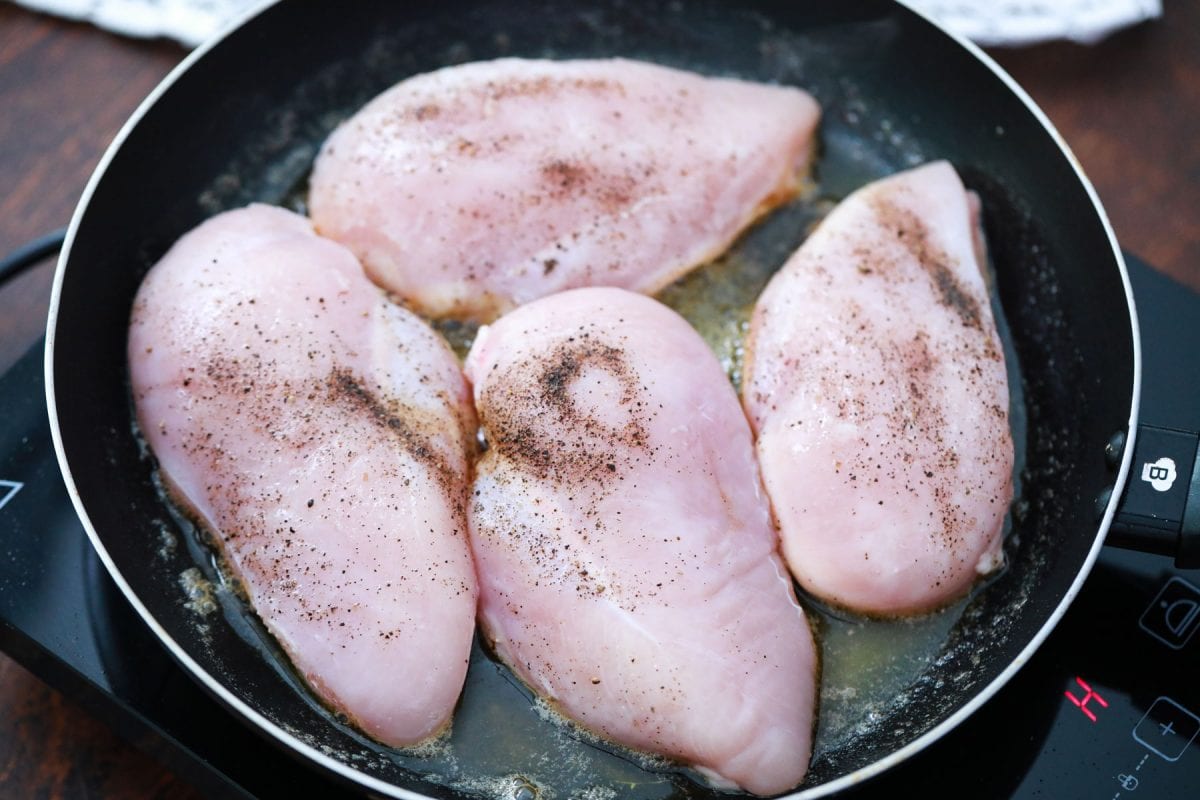 browning chicken breasts in a skillet 