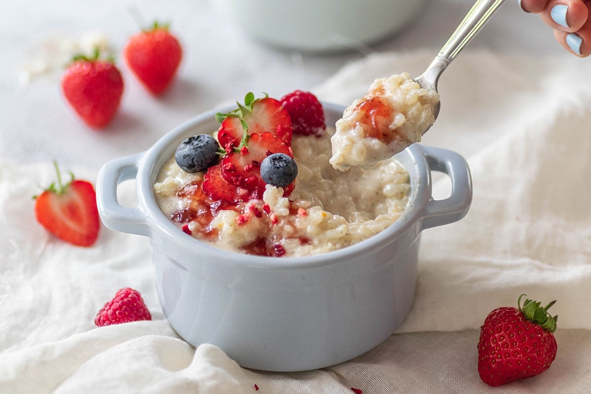 spoon coming out of rice pudding serving dish