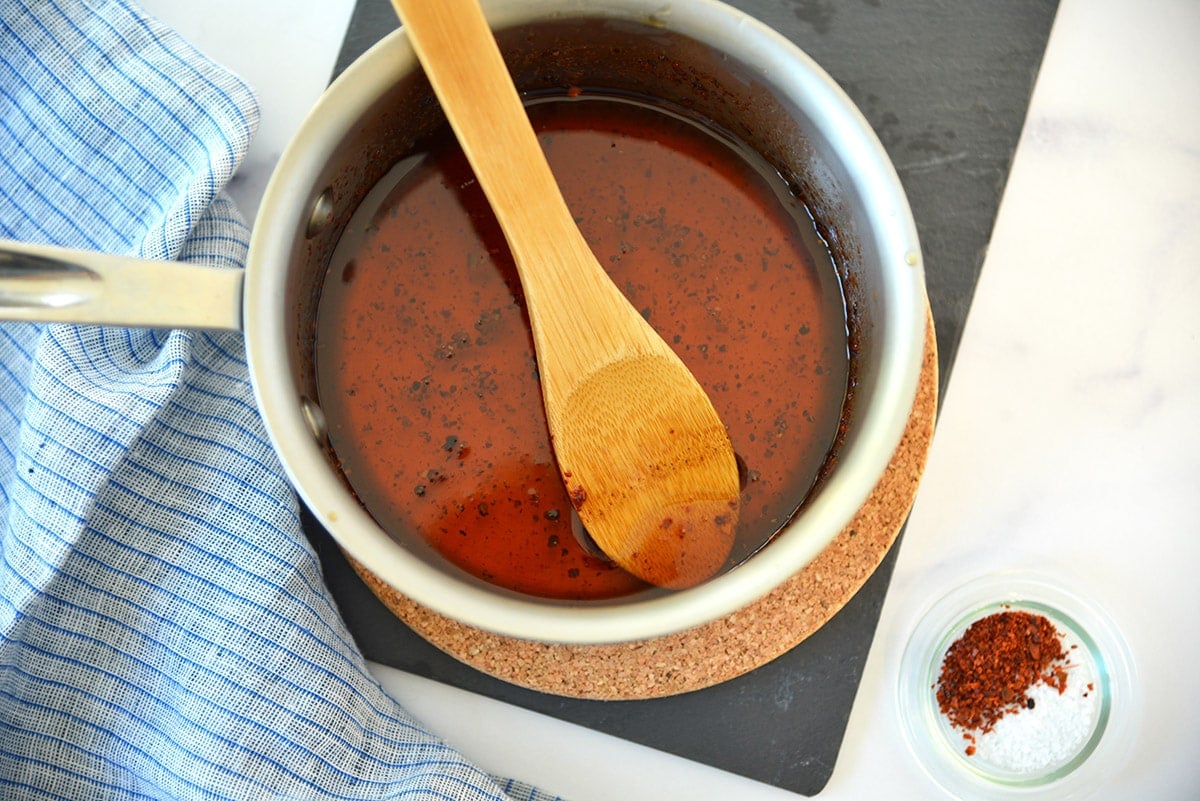 saucepan of homemade hot honey with aleppo pepper 