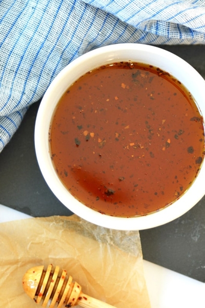 overhead of hot honey in a small white bowl