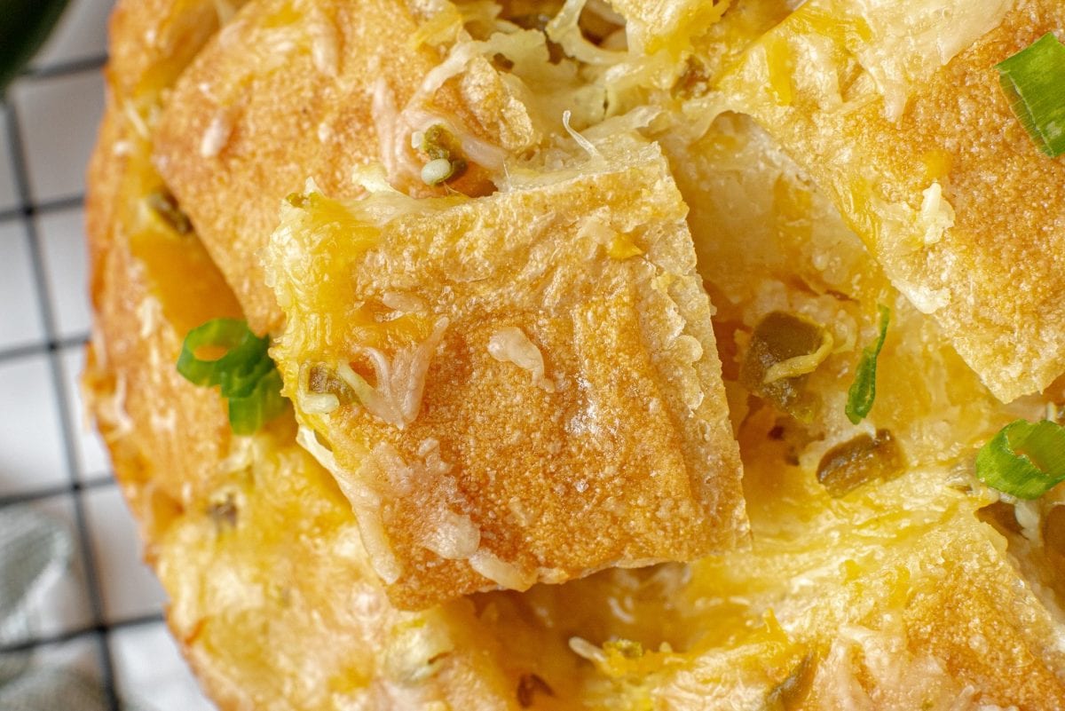 close up of cheesy bread with jalapenos 