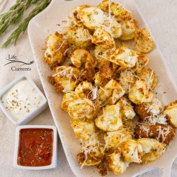 fried tortellini on a tray