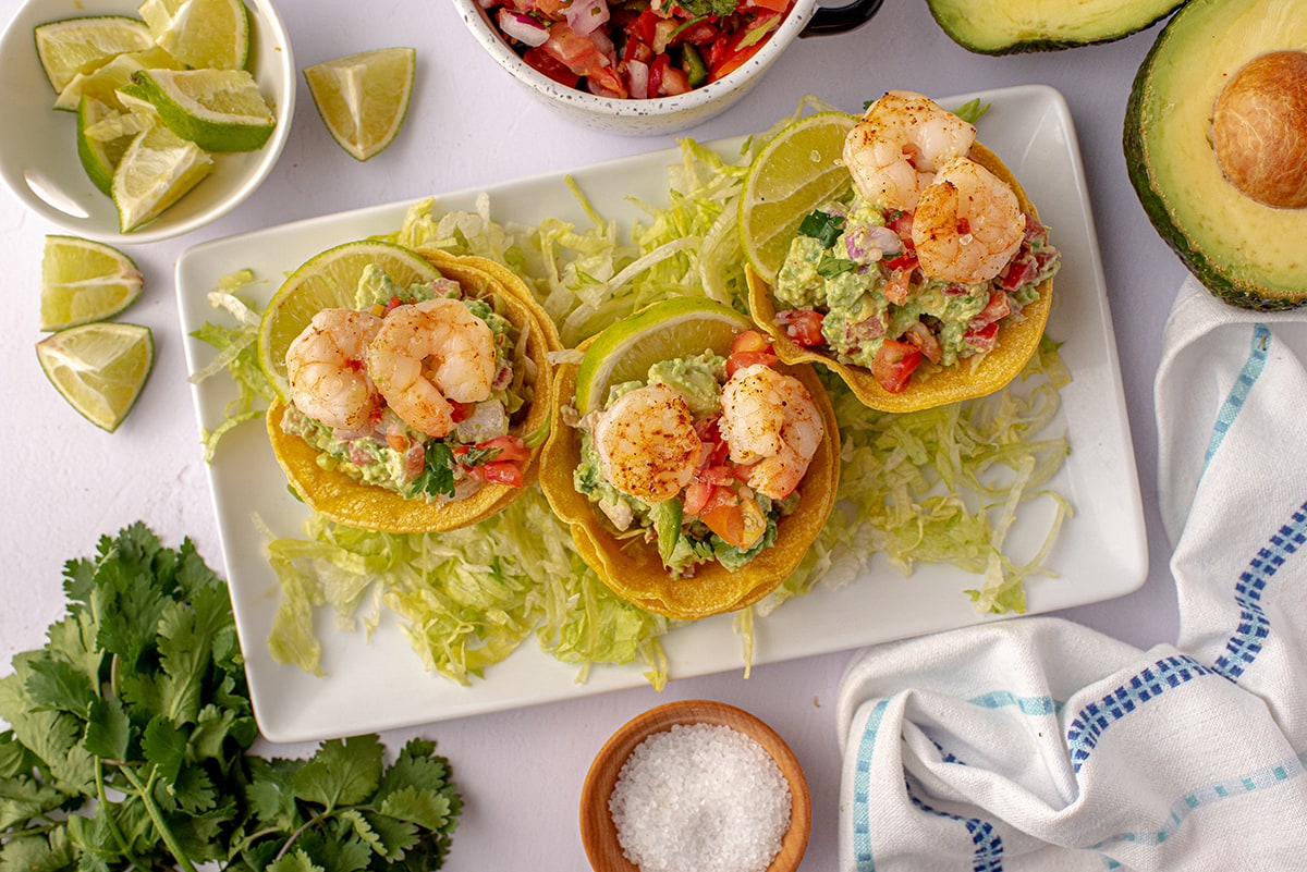 shrimp tostada appetizer on a white serving plate 