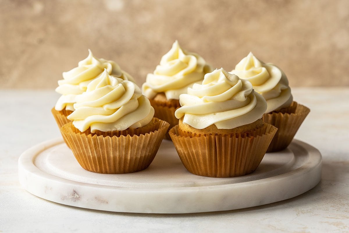 frosted cupcakes on a marble plate 