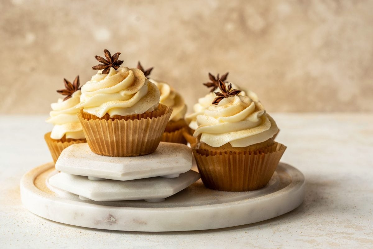 cupcakes decorated with frosting and star anise 