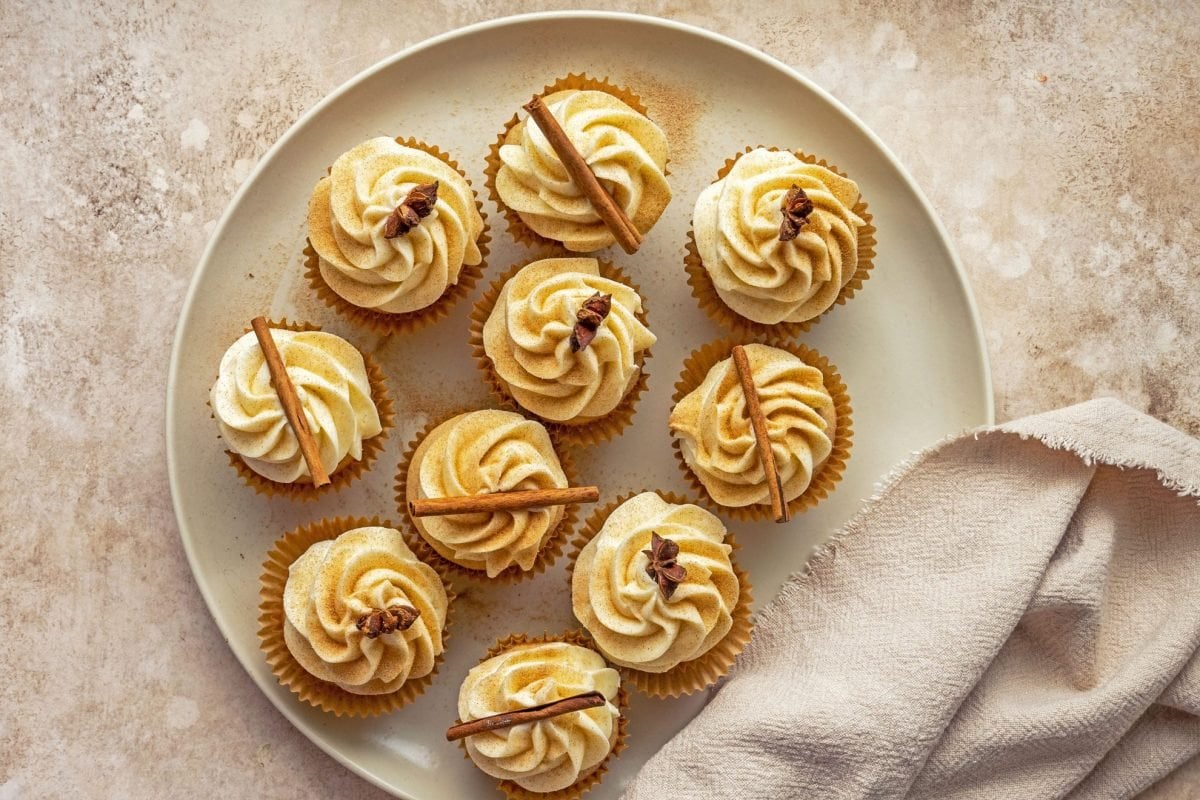 overhead of decorated spice cupcakes on a serving plate 