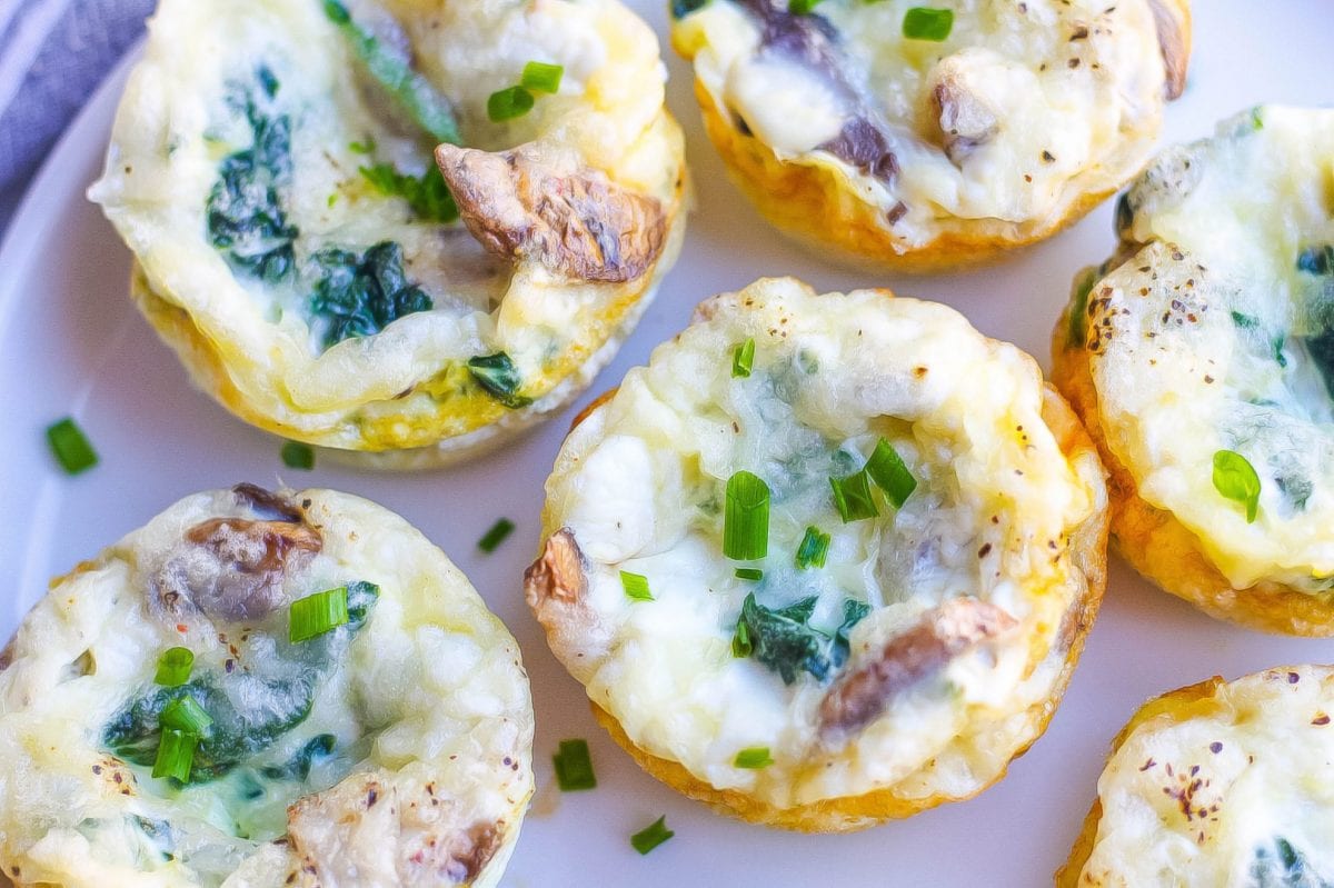close up of egg muffins on a plate with chives 