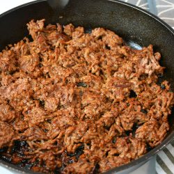 cast iron of browned ground beef