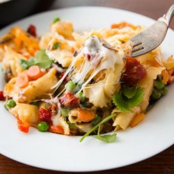 fork digging into tortellini pasta