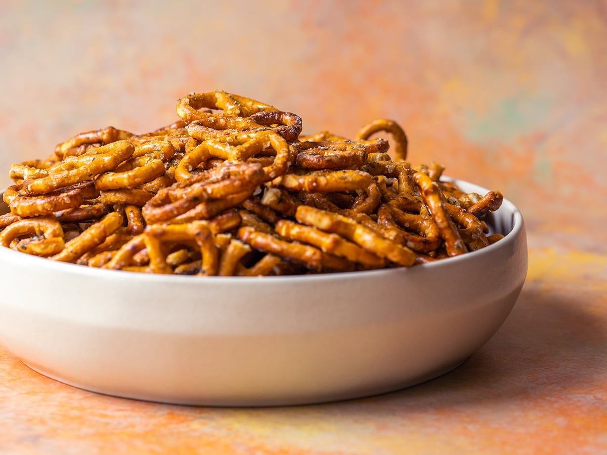 straight on shot of bowl of dill pickle ranch pretzels