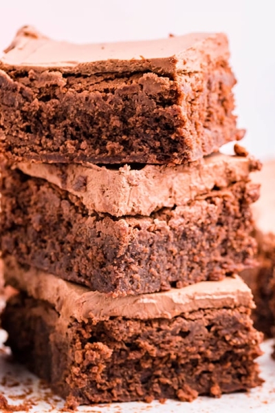 stack of frosted brownies