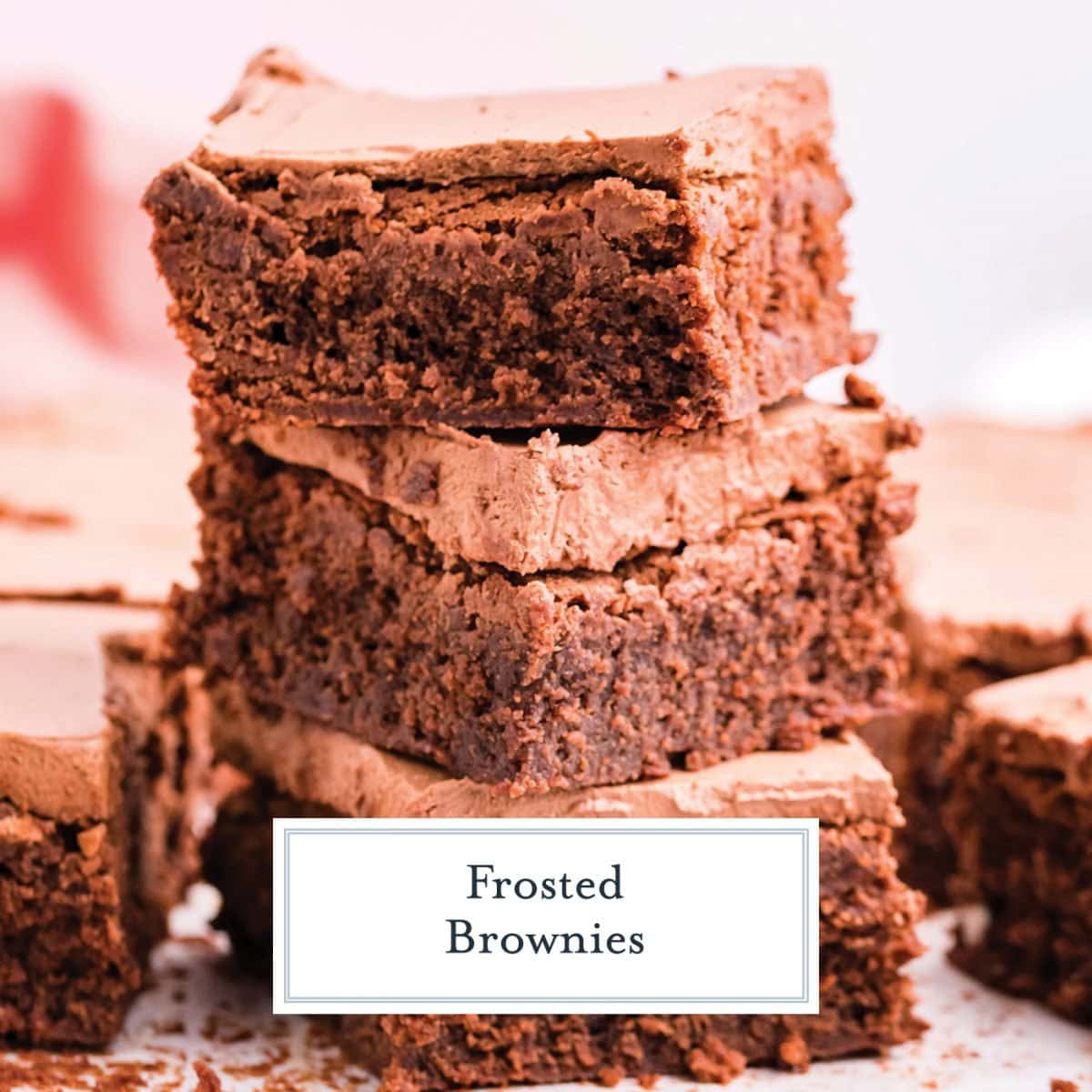 stack of brownies with chocolate frosting