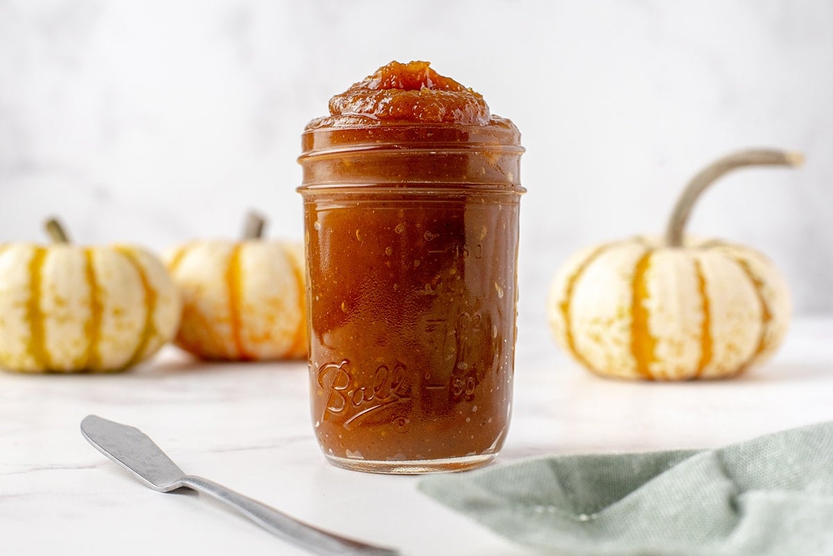 side view of pumpkin butter in a glass jar 