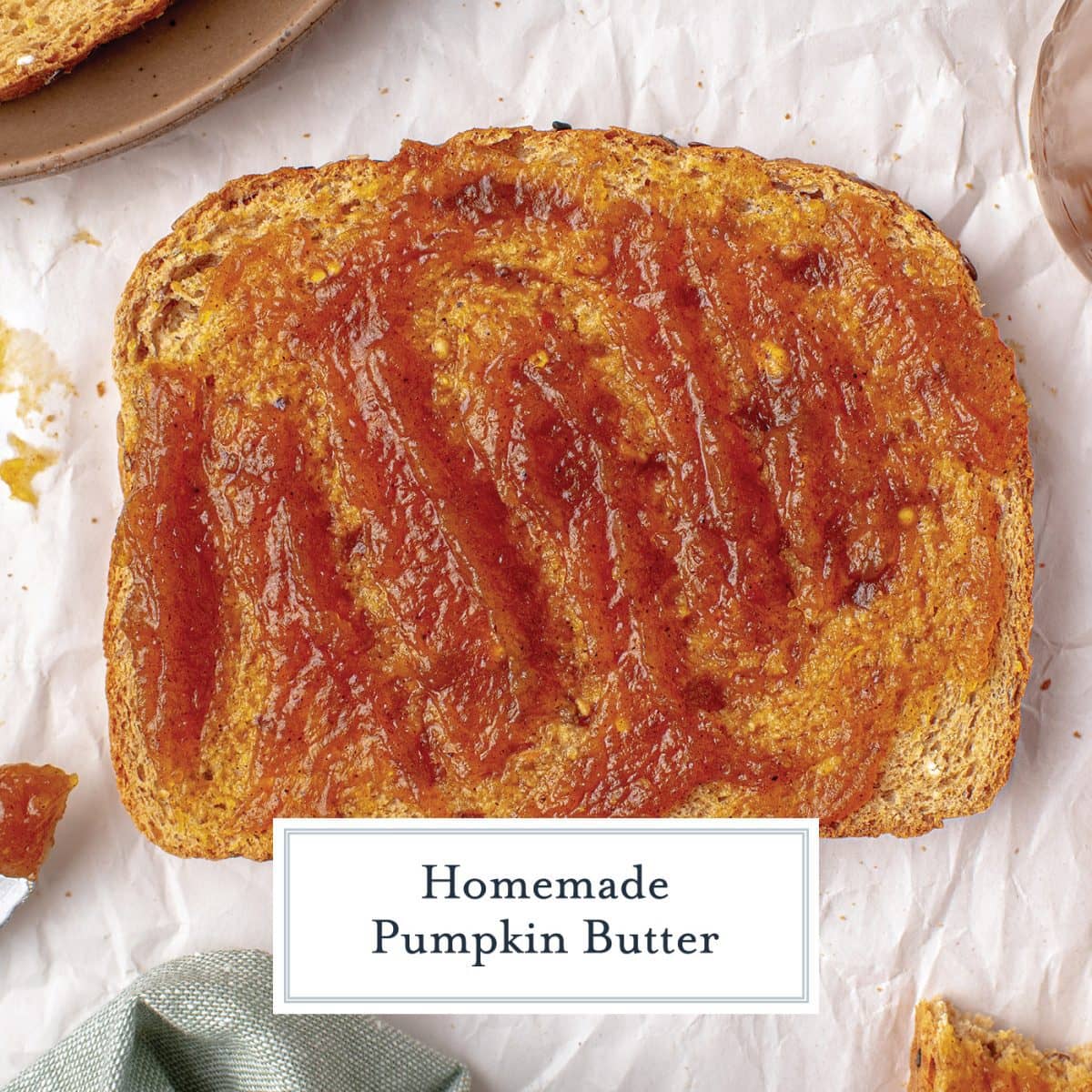 close up of pumpkin butter slathered onto a slice of toast 