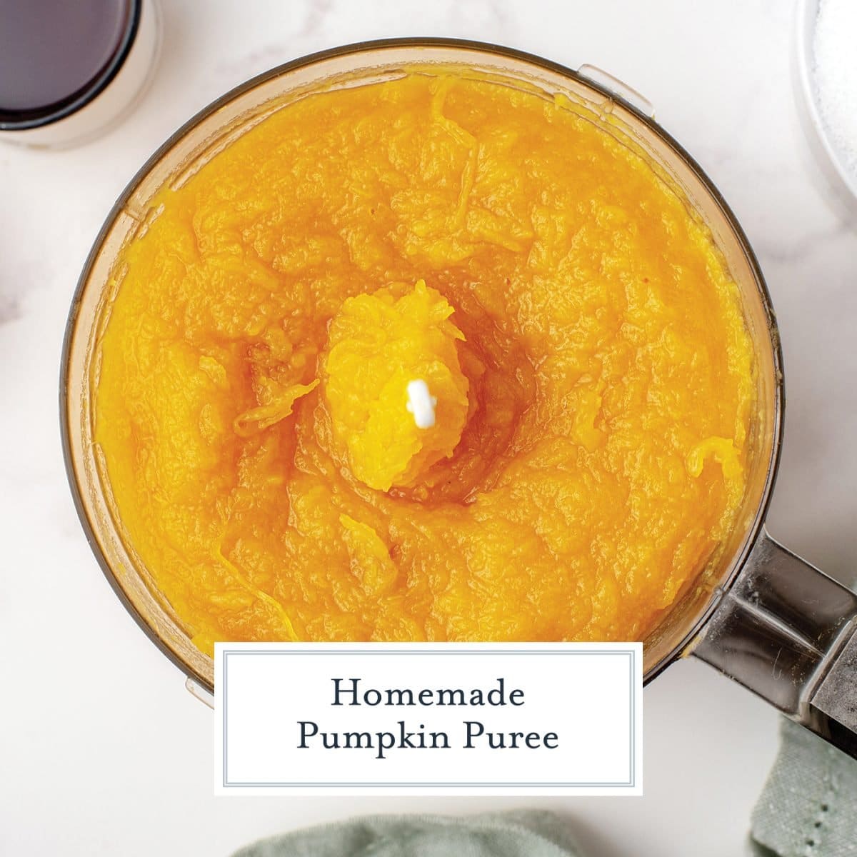 overhead of pumpkin puree in a food processor 