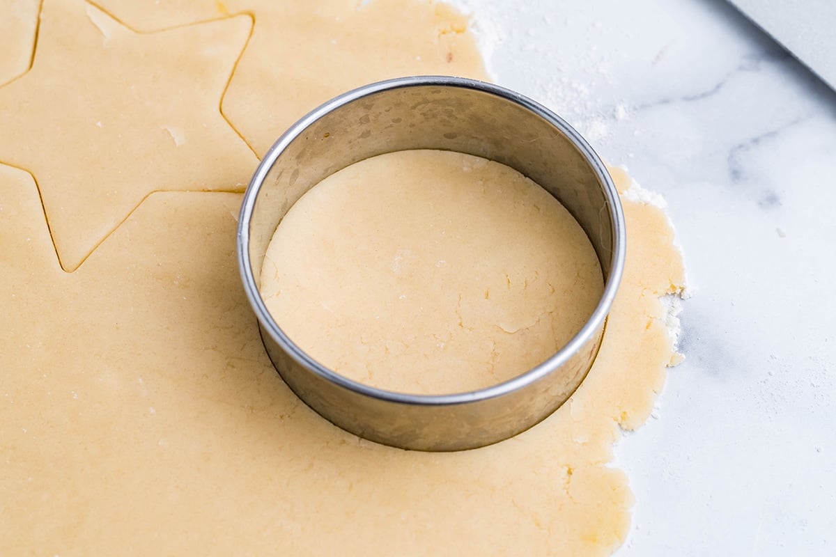 rolled cookie dough with a circle cookie cutter