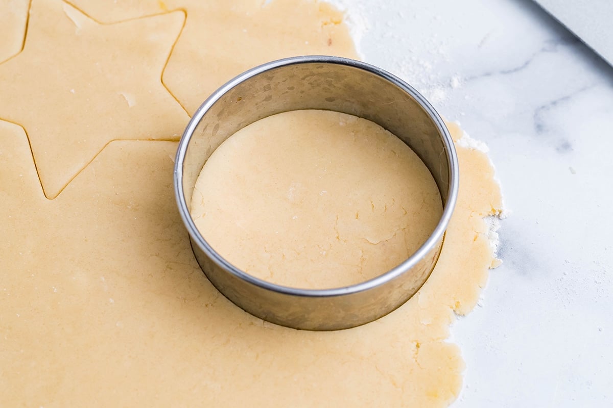 rolled cookie dough with a circle cookie cutter 