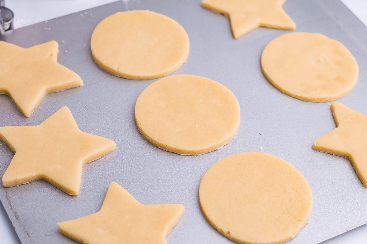 sugar cookie cutouts on a baking sheet 
