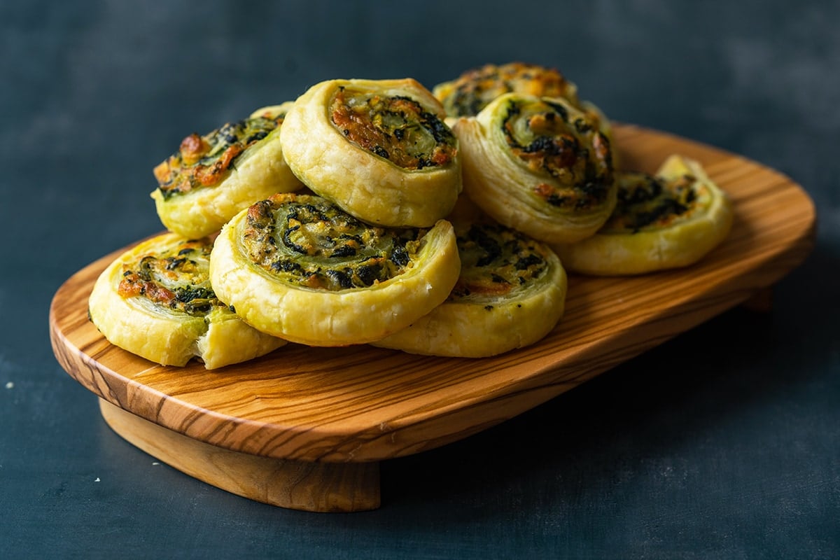 angle view of wood cutting board with pinwheels 