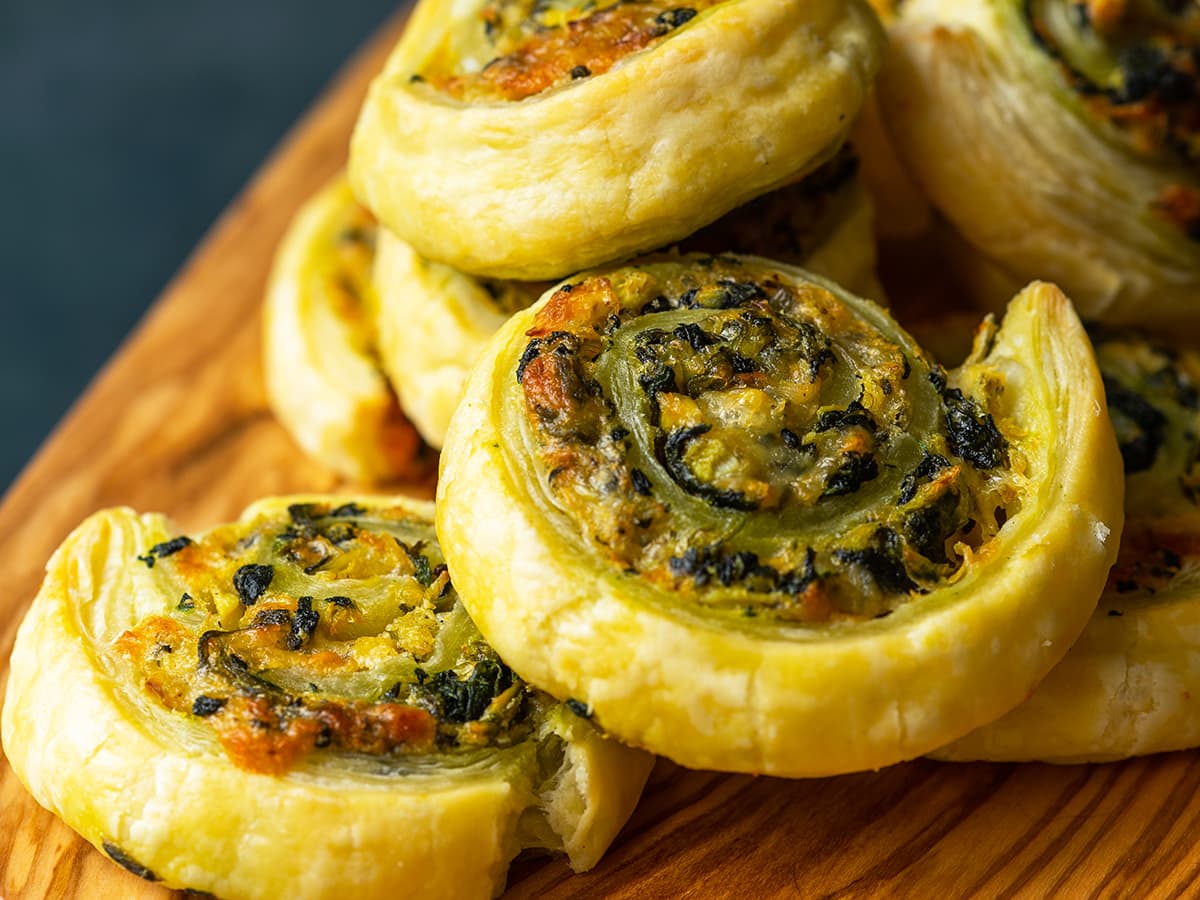 close up of spinach puff pastry pinwheels