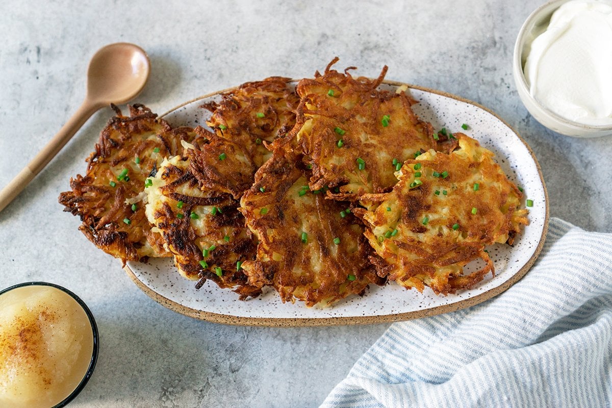 overhead speckled serving platter of classic latkes 