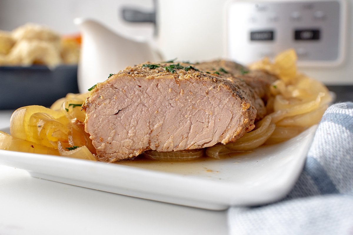 angle look at sliced pork on a serving platter 