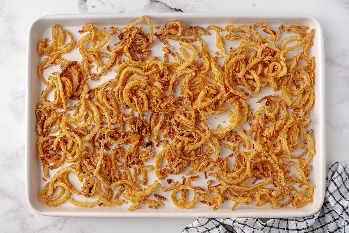 crispy fried onions on a baking sheet 