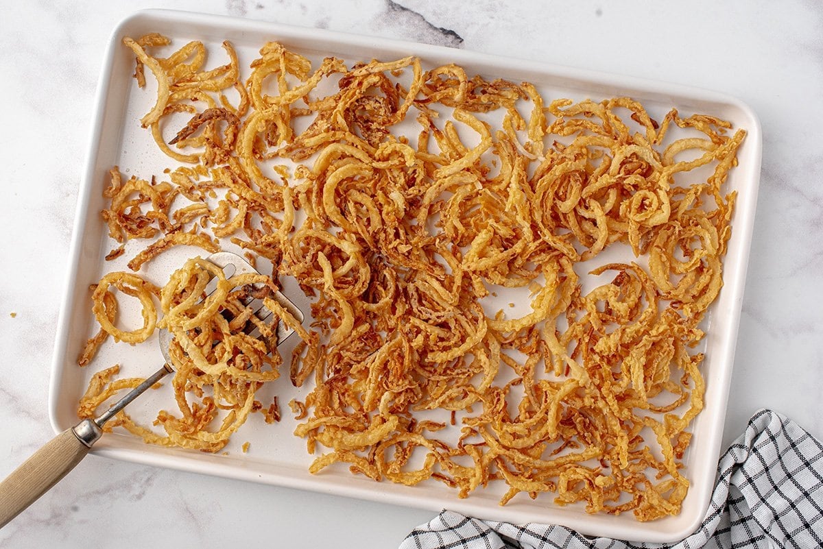 onion strings on a baking sheet 