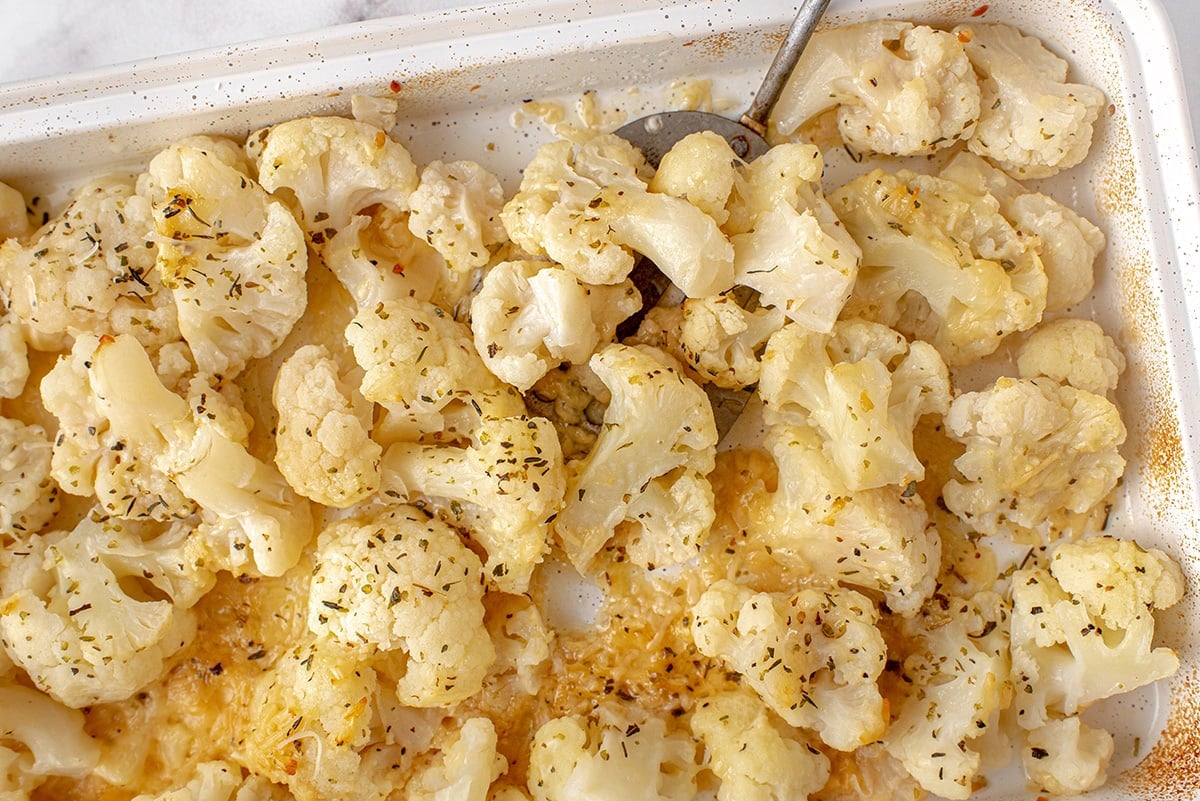 spatula picking up roasted cauliflower 