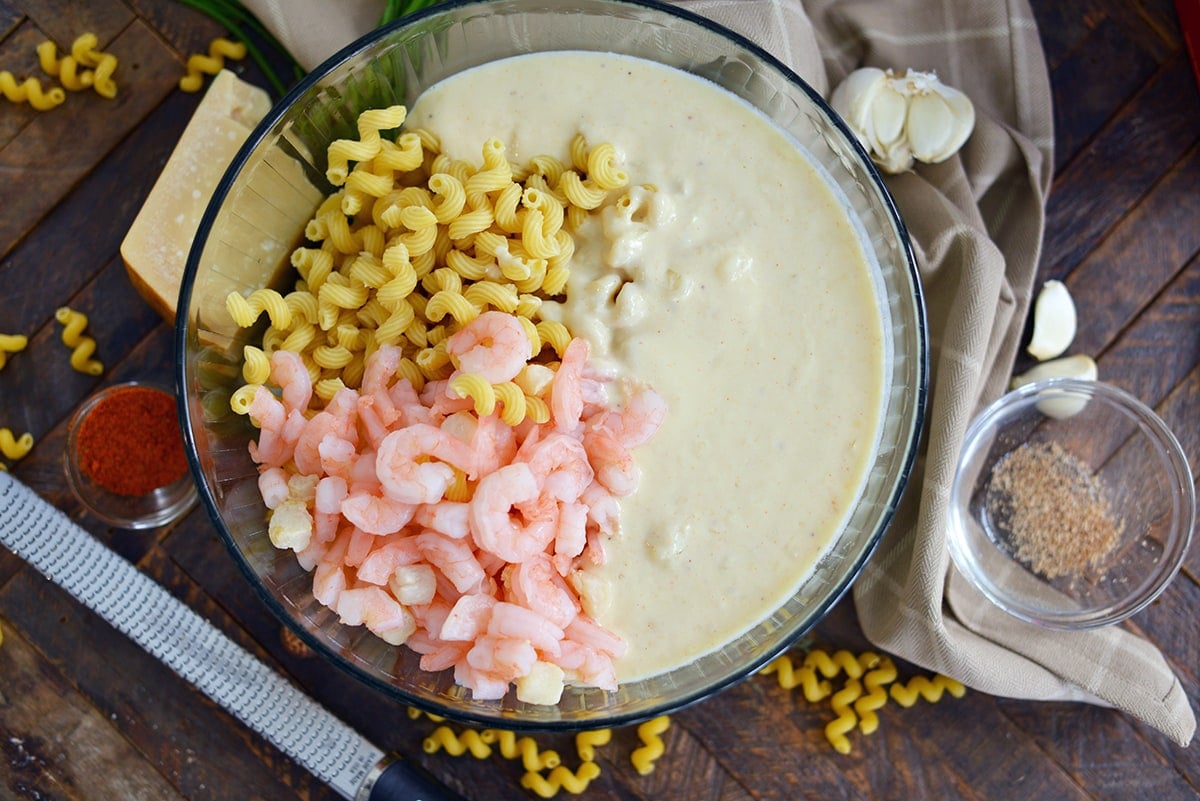 pasta, roux and seafood in a mixing bowl 