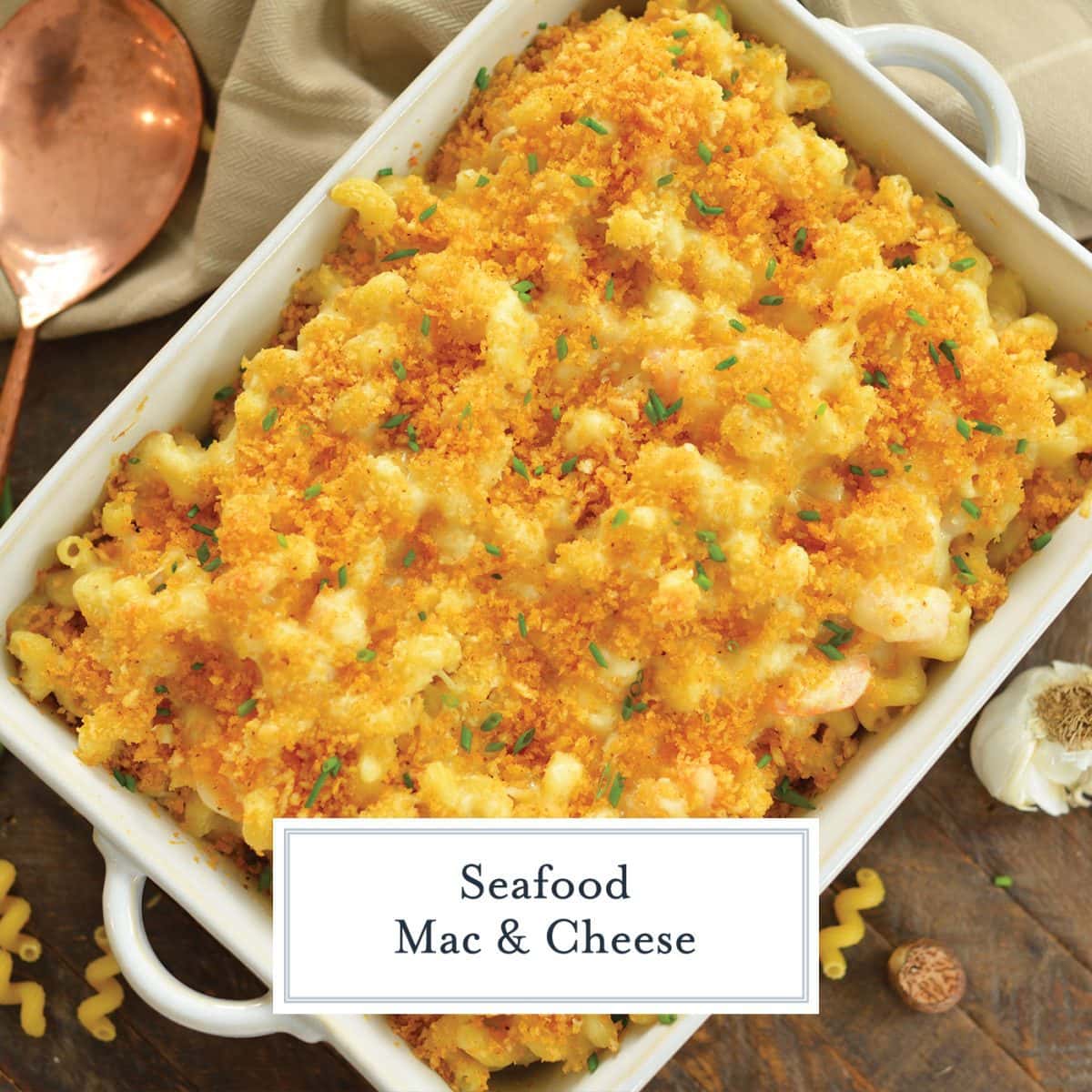 overhead dish of seafood mac and cheese with crunchy topping and chives 