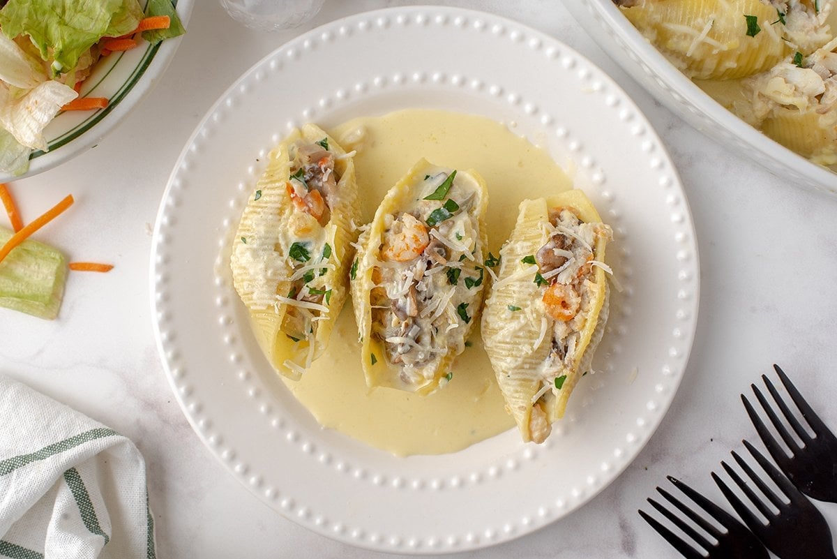 seafood stuffed shells on a small plate 