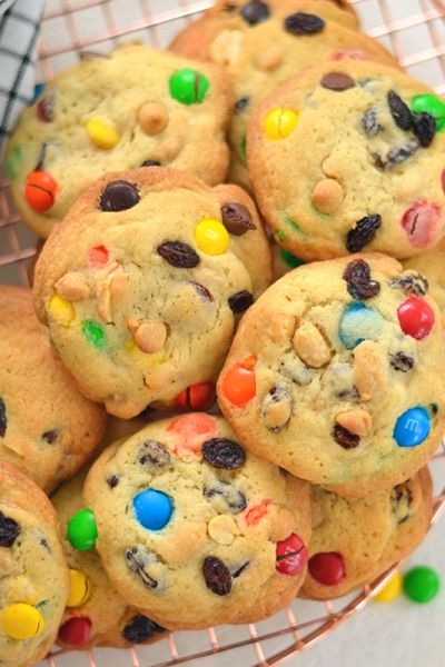 overhead of trail mix cookies on a wire cooling rack