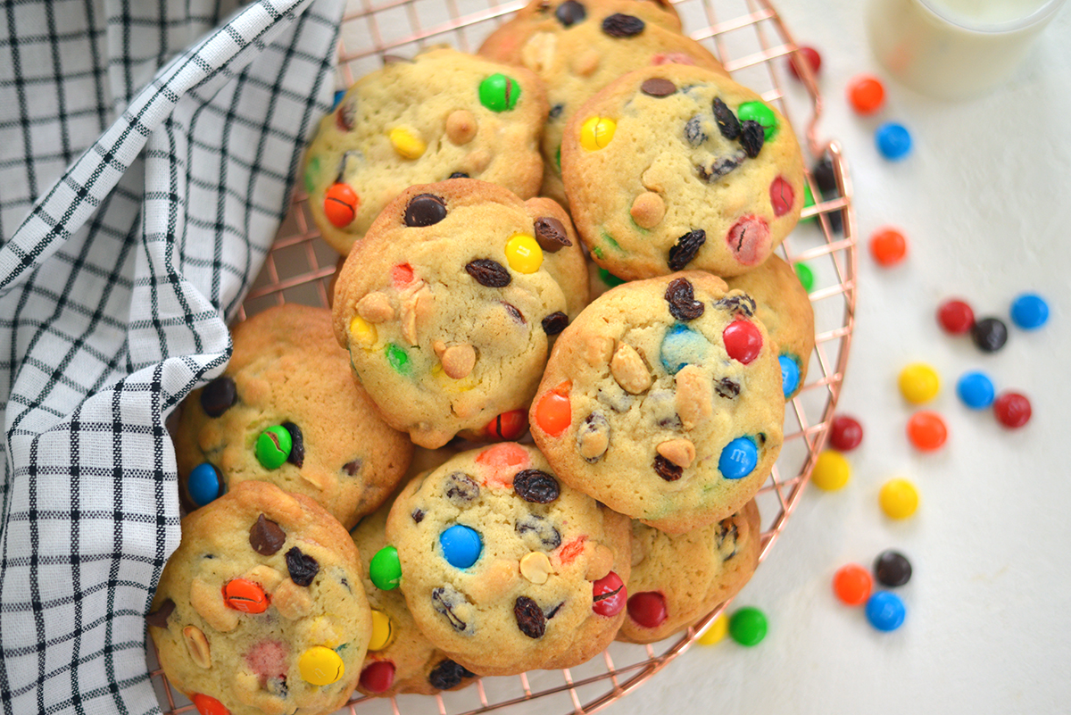 overhead of trail mix cookies on a wire cooling rack