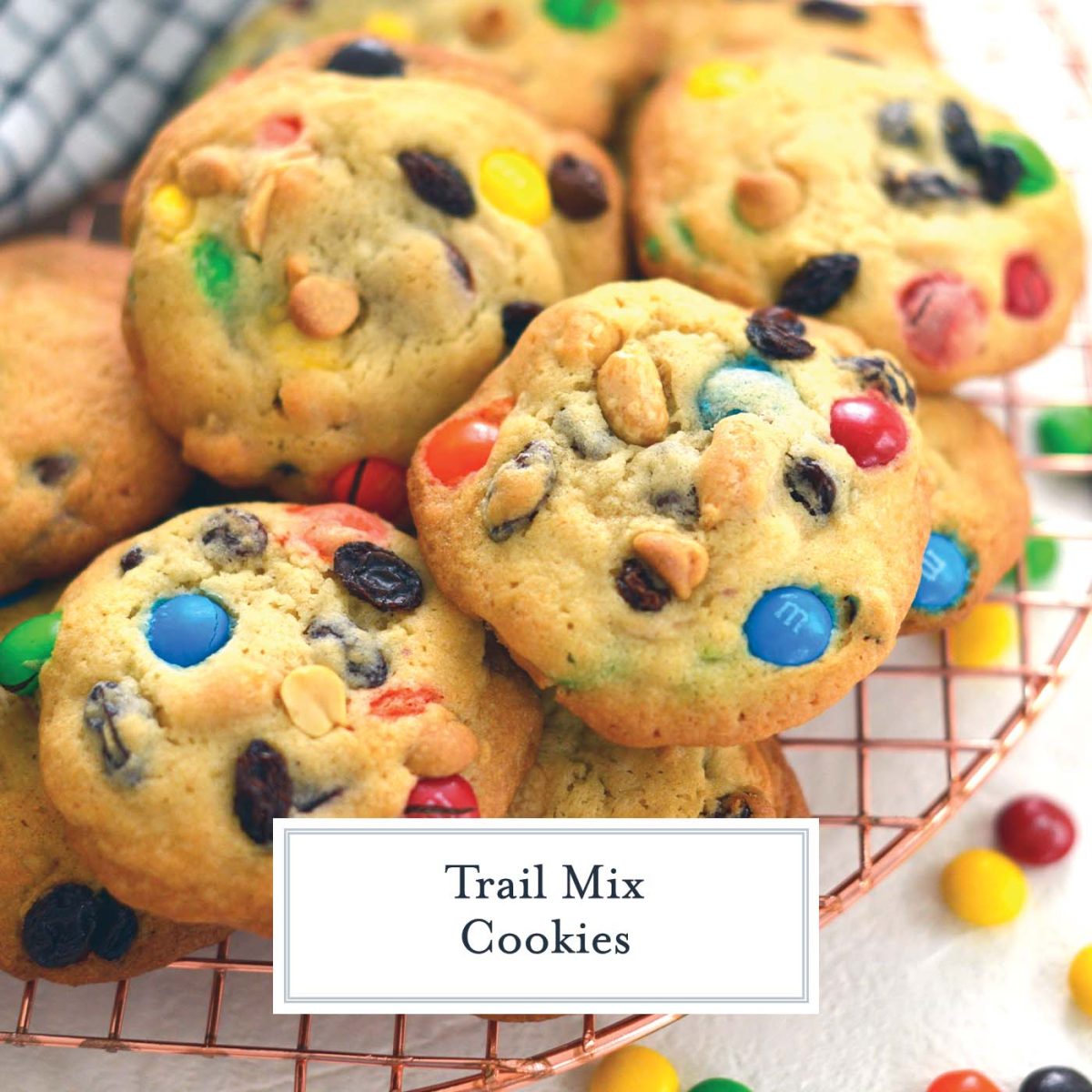 close up of trail mix cookies on a cooling rack 