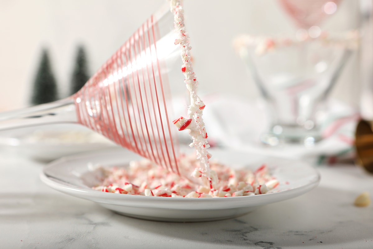 rimming a martini glass with candy canes 