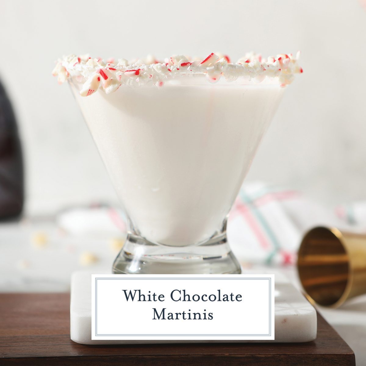close up of a white chocolate martini with candy cane rim 