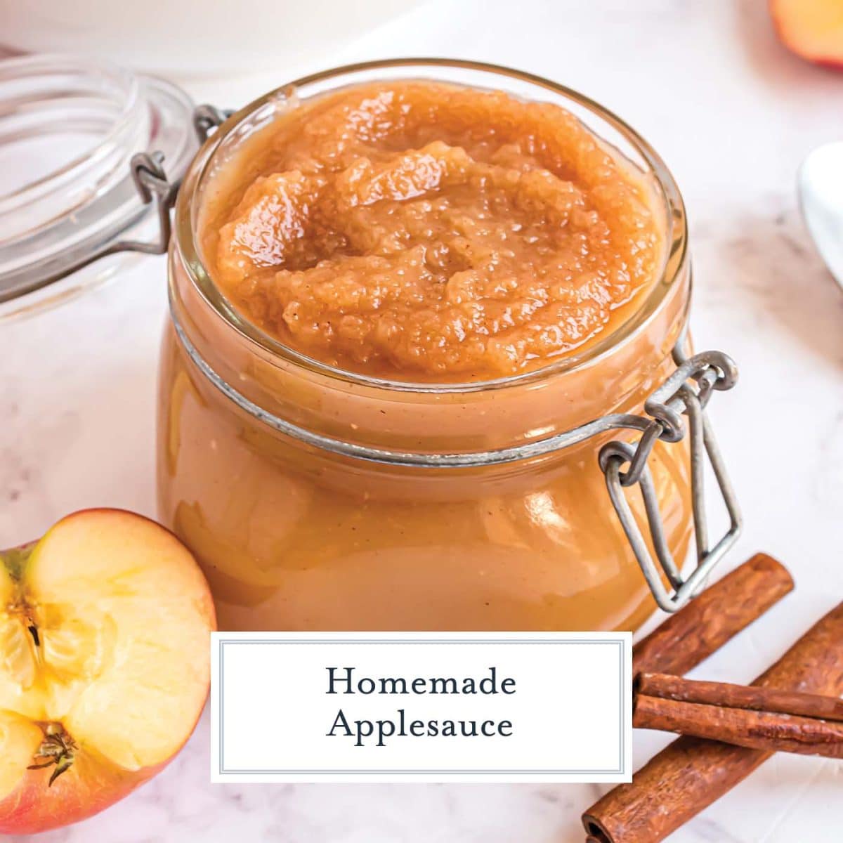 homemade applesauce in a mason jar with fresh apples and cinnamon