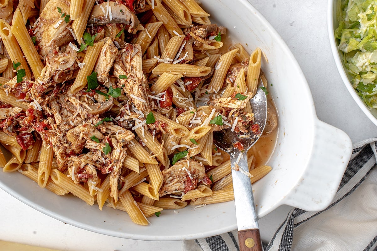 spoon in a serving dish of pasta 