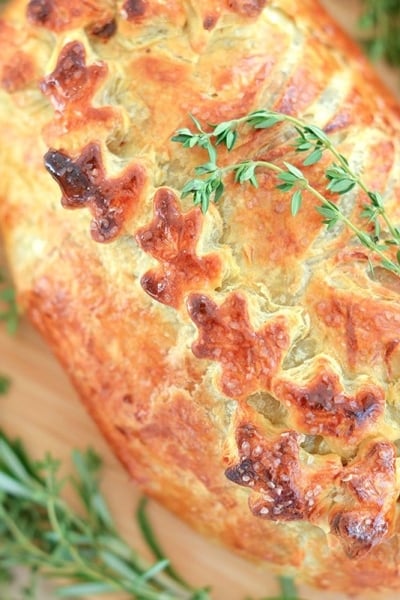 overhead of beef wellington with fresh thyme