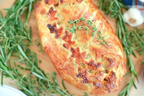 overhead of beef wellington with fresh thyme