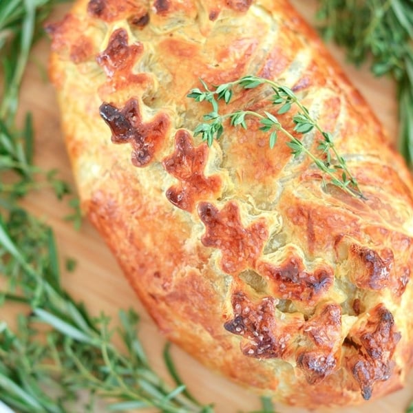 overhead of beef wellington with fresh thyme