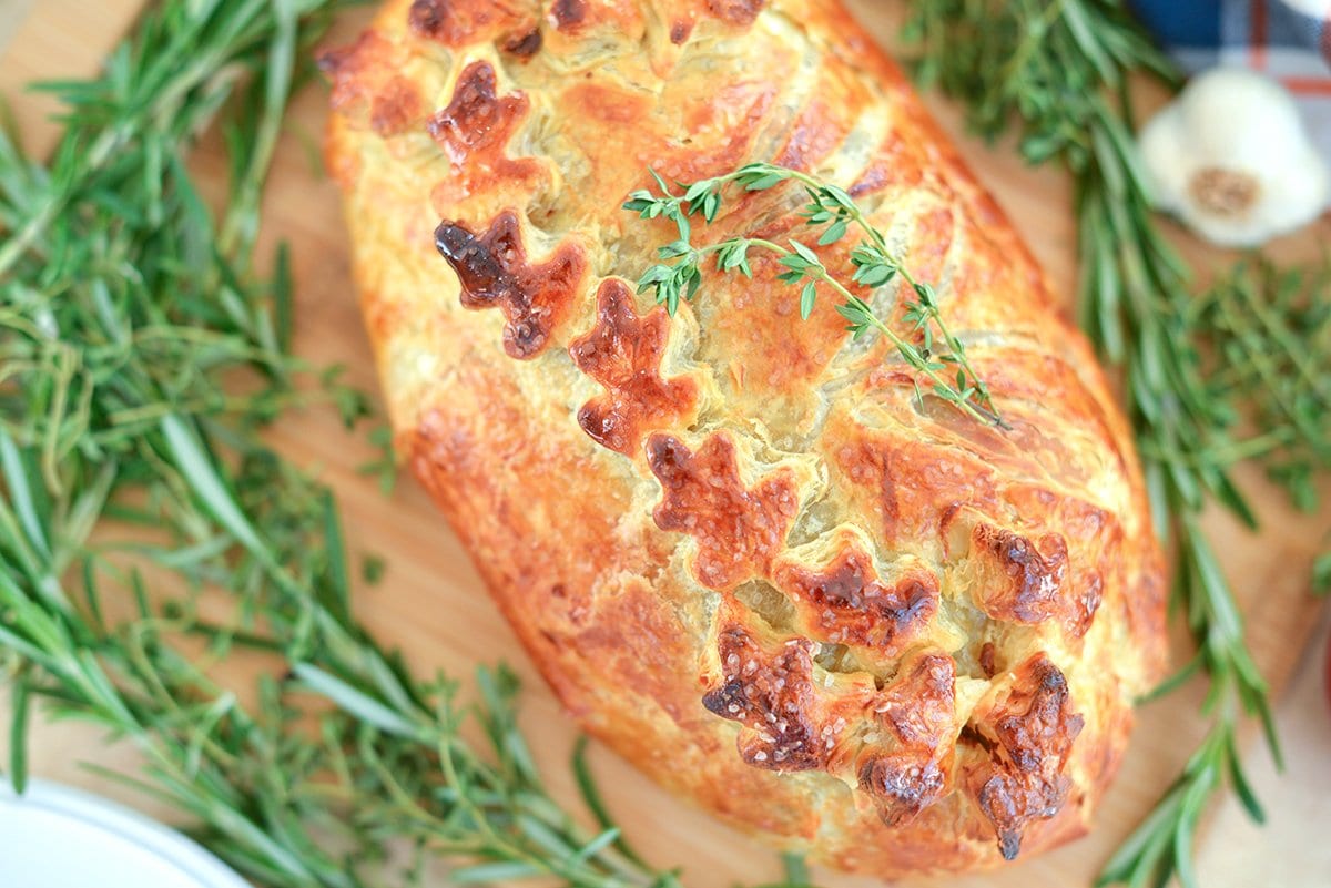 overhead of beef wellington with fresh thyme