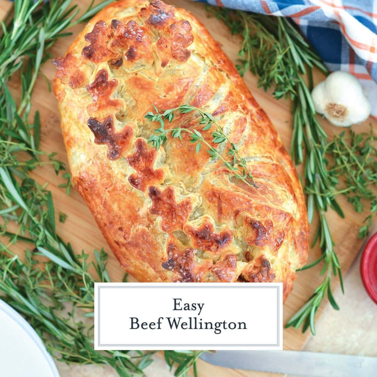 overhead image of beef wellington with thyme leaves 