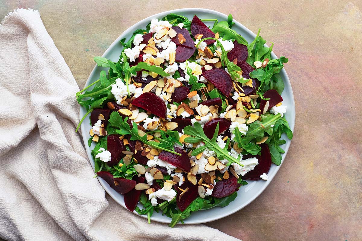 overhead of beet and goat cheese salad before being dressed