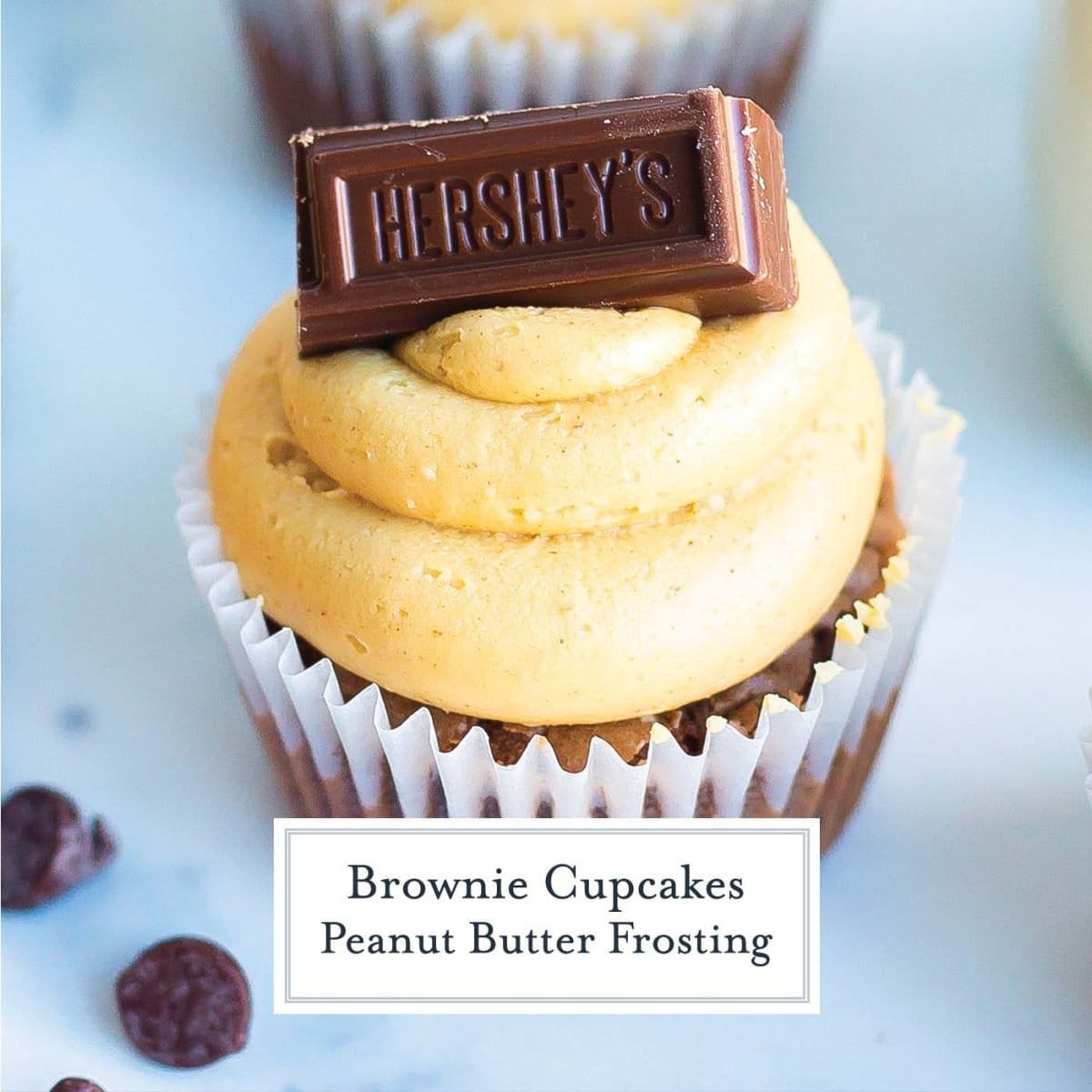 close up of chocolate brownie cupcake with peanut butter frosting 