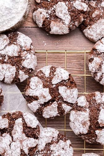 chocolate crinkle cookies on a wire cooling rack