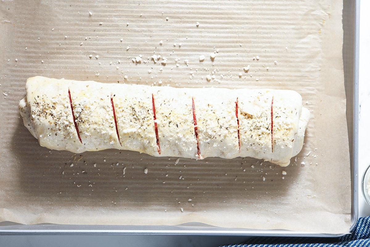 sliced stromboli dough on a baking sheet 